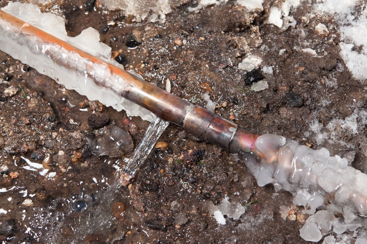 Frozen Pipe that Has Burst And Leaked Water All Over Ground