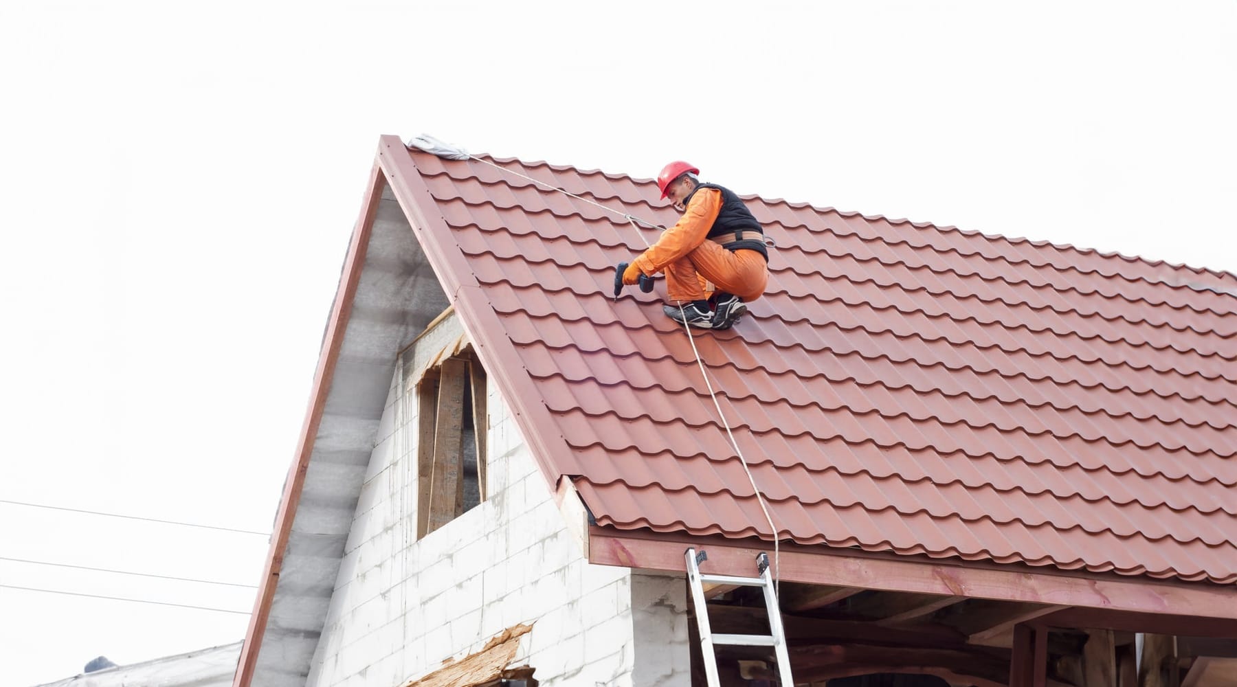 Worker Repairing Residential Metal Roof - AllDone Construction